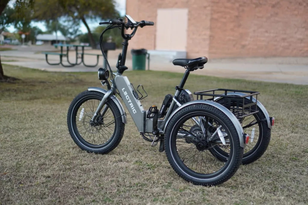 black electric trike, on the green grass